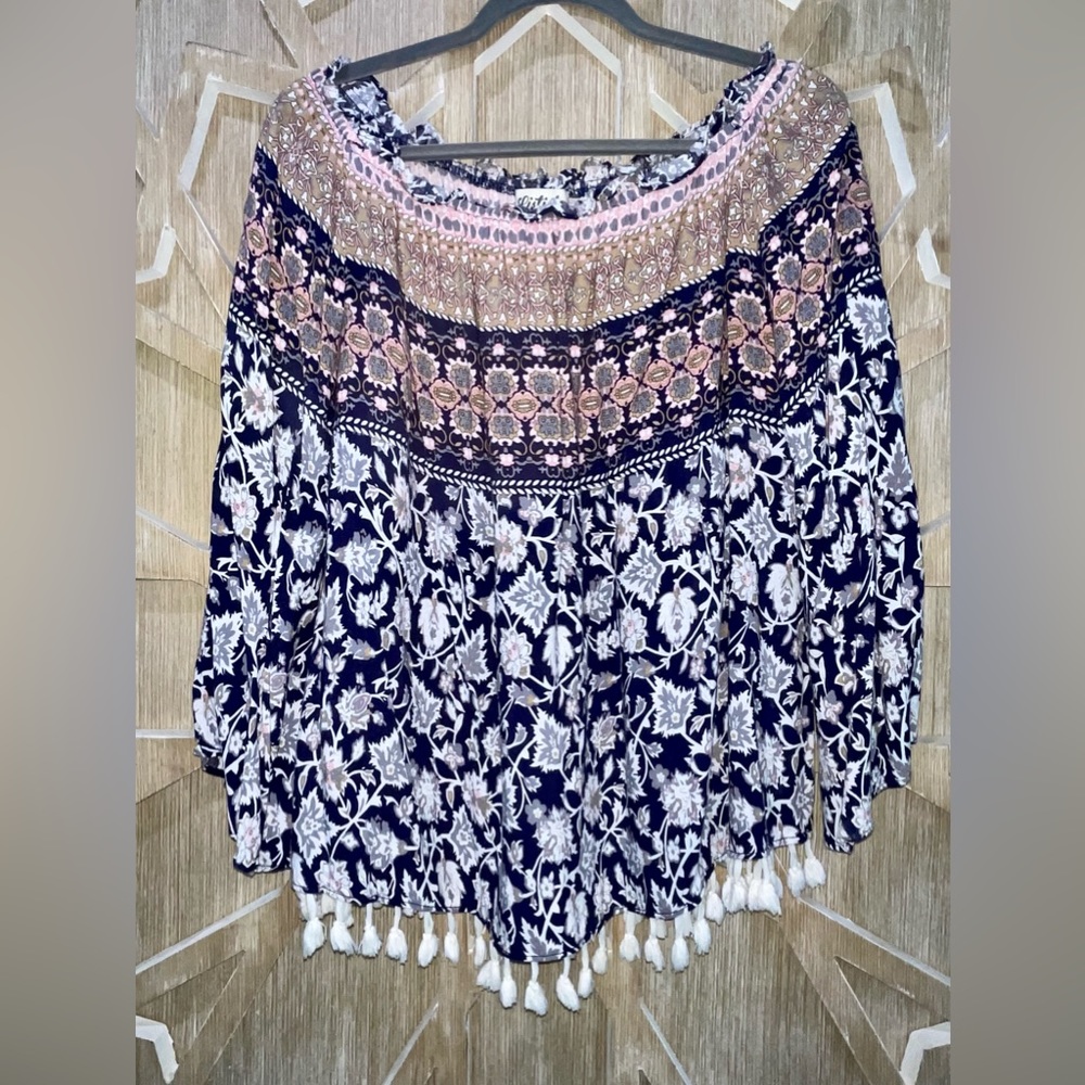 Listicle Boho off the shoulder top with tassels and bell sleeves.